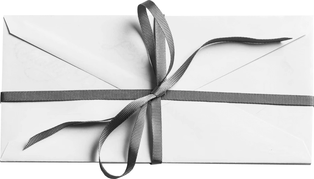 Envelope wrapped with ribbon and bow, resembling a wrapped letter or gift.